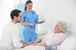 © Africa Studio - Young man talking with grandmother and nurse