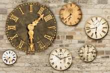 Vintage Clocks Hanging On An Old Brick Wall