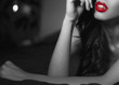 Sexy woman with red lips in selective black and white template