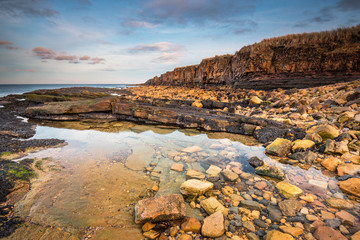 Sticker - Rock Pool below Ebb's Nook, also known as Beadnell Point, is a headland just north of Beadnell harbour