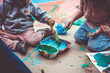 Children playing with tempera paints