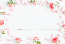 Flowers Composition. Pink Flowers On White Wooden Background. Flat Lay, Top View