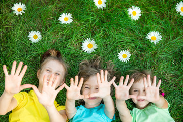 Wall Mural - Group of happy children playing outdoors