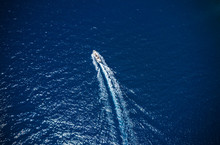 Aerial View Of Small Boat Flowing In Sea