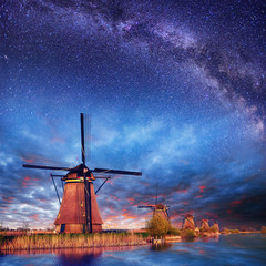 Wall Mural - Dutch mill at night. Starry sky. Holland. Netherlands