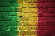 painted national flag of mali on a brick wall