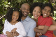 African American mother and father and their children.
