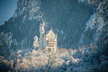 Snowy Bavarian Alps And Neuschwanstein Castle At Foggy Morning, Bavaria, Germany.