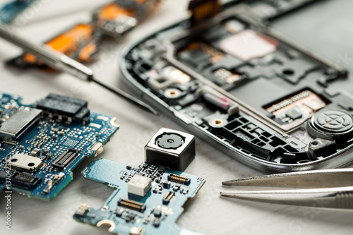 Fotografía Parts of digital gadgets with tools. Repair and service concept
