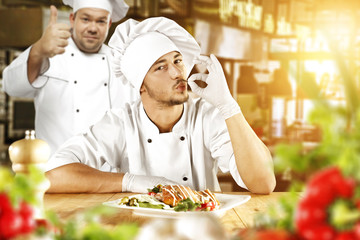 Wall Mural - cook chef and food in kitchen 