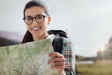 Young hiker holding a map