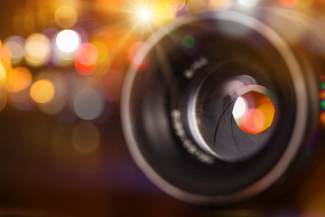 Camera lens with bokeh background.