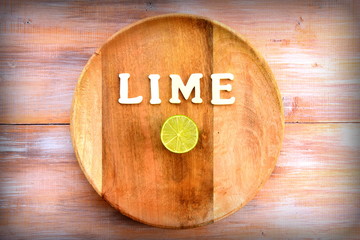 lime halved on round rustic cutting board 