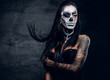 © Fxquadro - A woman with painted skull face.