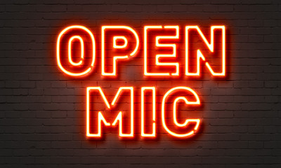 Wall Mural - Open mic neon sign on brick wall background.