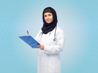 Wall Mural - muslim female doctor in hijab with clipboard