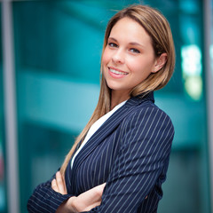 Wall Mural - Smiling businesswoman outdoor