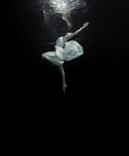 Young Female Ballet Dancer Dancing Underwater