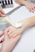 Beautician Doing Hand Massage In Beauty Salon