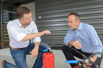 Men with fire extinguishers