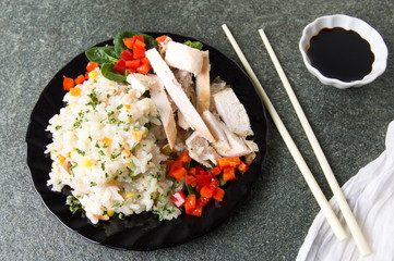 Wall Mural - Chicken with rice and vegetables on a plate