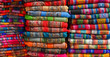 A pile of colorful rugged Peruvian textile and fabrics.