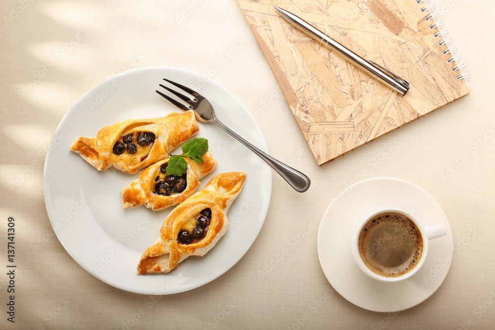 Tasty puff pastry with berries on plate