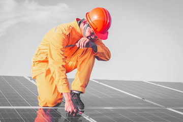 Wall Mural - engineer working on checking and maintenance equipment at green energy solar power plant: Wrench tightening at solar mounting structure 