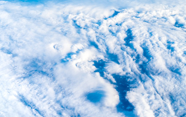 Wall Mural - close up cloud top view sky from airplane window,nature background,aerail view