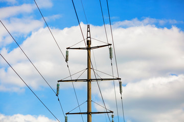 Wall Mural - Old power lines. Electricity transmission pylon against the blue sky. High voltage tower.