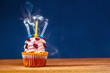 Cupcake with three blown out candles on top