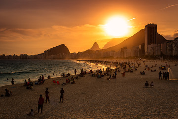 Fototapete - Sunset View in Copacabana Beach with Mountains in Horizon and Tall Hotel Building, Rio de Janeiro