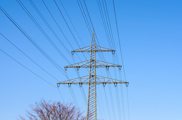 High tension power lines in sky