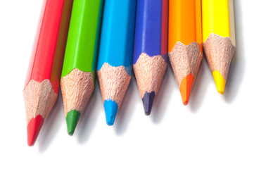 Colored pencils isolated on a white background macro