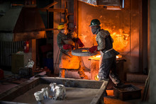 Metalworkers Working In Foundry