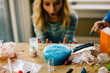 © Connect Images - Girls doing science experiment, surprised by blue liquid foaming in frying pan