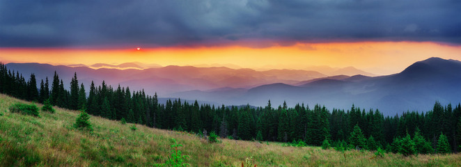 Wall Mural - colorful sky with sun background in mountains. sunset, sunrise. 