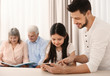 © Africa Studio - Young father and cute daughter with tablet at kitchen table