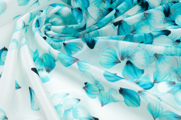 silk fabric texture. blue flowers