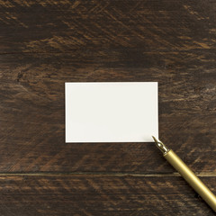 Wall Mural - Thick cardboard business card with ink pen and copyspace