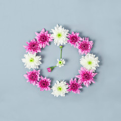 Clock face made of chrysanthemum.