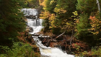 Wall Mural - Looping footage features Au Sable Falls, an especially beautiful waterfall, shot with autumn color at Pictured Rocks National Lakeshore in Upper Peninsula of Michigan not far from Grand Marais.