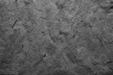 Abstract gray texture. Dark paper background. Abstract  background and texture for designers. Old vintage recycled paper. Black abstract background. Dark rough paper.