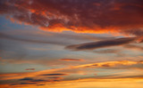 Fototapeta  - Sunset sky orange clouds over blue