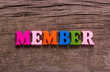 © adragan - member word made from colored wooden letters on an old table. Concept