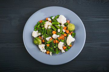 Delicious mix of vegetables on the plate. View from above. Close-up