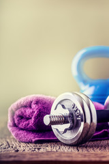 Wall Mural - Fitness Equipment. Kettlebell  dumbbells towel water and measuring tape.