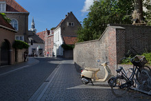 Bergen Op Zoom Netherlands. Noord Brabant. Street With Bike And Scooter.
