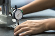 © photostriker - worker measure part precision by dial guage