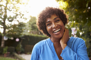 portrait of mature woman in back yard garden